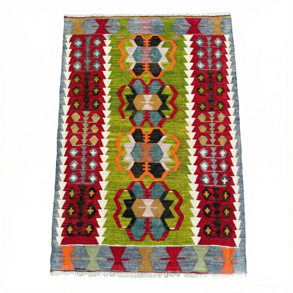 Vintage handwoven Turkish Eşme kilim rug with a bright green center field featuring geometric medallions and deep red borders. Small boho area rug or wall hanging in green, red, and blue wool.